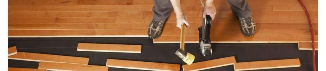 Man installing hardwood floor